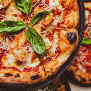 a close up of a pizza on a plate